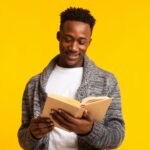Man reading a book; purpose-driven leadership books